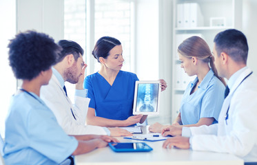 Wall Mural - group of doctors with x-ray on tablet pc at clinic