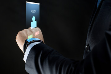 Poster - close up of businessman hand with smartwatch