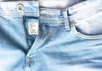 Sticker - Denim jeans background with slogan.