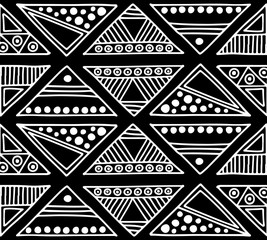 Wall Mural - Seamless vector pattern. Black and white geometrical background with hand drawn decorative tribal elements. Print with ethnic, folk, traditional motifs. Graphic vector illustration.
