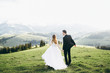 © shunevich - Beautiful bride and groom at the mountains