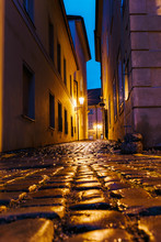 Mysterious Narrow Alley With Lanterns And Pavement Stones In Prague Street At Night