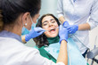© DenisProduction.com - Woman at the dentist office. Dental doctors at workplace. Trust health to best professionals.