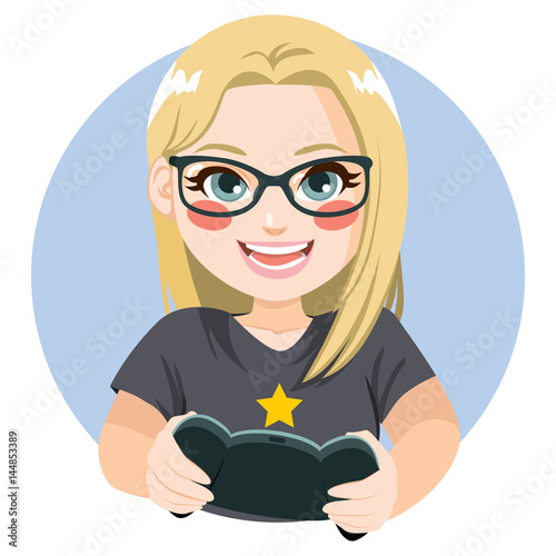 Happy delighted blonde gamer girl with glasses playing video games