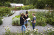 © Maskot - High angle view of architects communicating at community garden