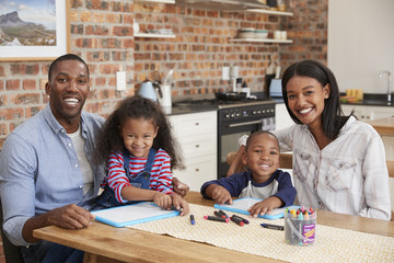 Wall Mural - Portrait Of Parents And Children Drawing At Table