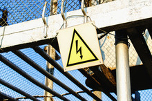 High Voltage Danger Sign In Fence Of Power Plant
