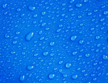 Water Drops On A Blue Background