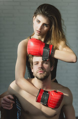 Sticker - Pretty girl in red boxing gloves hugging handsome man