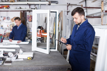 Wall Mural - Workman showing PVC manufacturing output