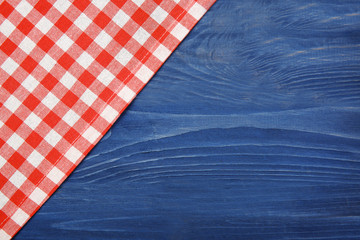 Wall Mural - Red napkin on wooden table