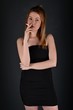 © muro - young woman with cigarette, smoking concept on black background