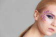 © Africa Studio - Beautiful young woman with creative makeup on color background