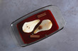 Sliced pear with wine and spices in glass dish