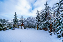 Snow Covered Play Ground In The Fraser Valley Of British Columbia, Canada On A Cold Winter Day And With Snow Covered Trees And Lawn
