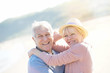© goodluz - Portrait of senior couple at the beach