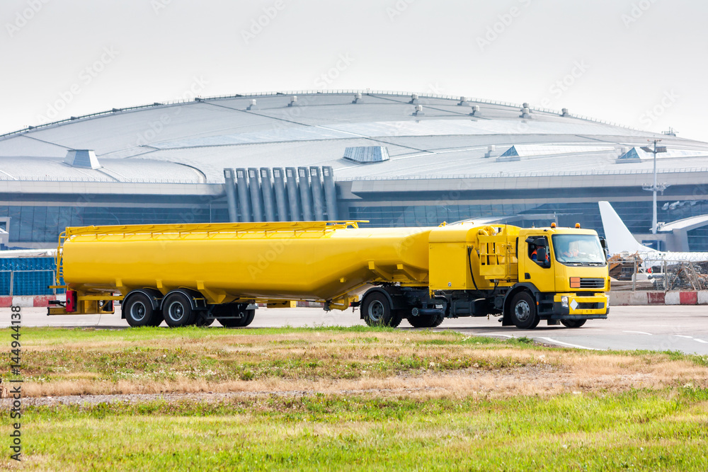 Yellow tank truck aircraft refueler at the airport apron Stock Photo ...