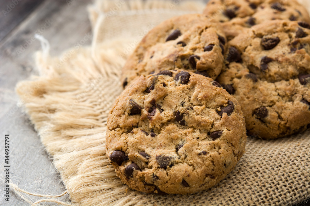 Close up chocolate chip cookies on wooden table background
