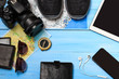© Agnes - Overhead view of traveler's accessories. Travel concept background. Essential vacation items, tourism mockup. Space for text