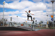 © guteksk7 - Skater jumping over funbox in skatepark
