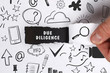 © Egor - Business, Technology, Internet and network concept. Young businessman shows the word: Due diligence
