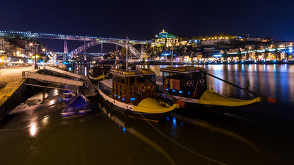 Porto by night. View of the waterfront Douro River and Luis I Bridge. Portugal