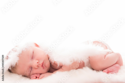 Photographie  Infant baby with angel wings on neutral background
