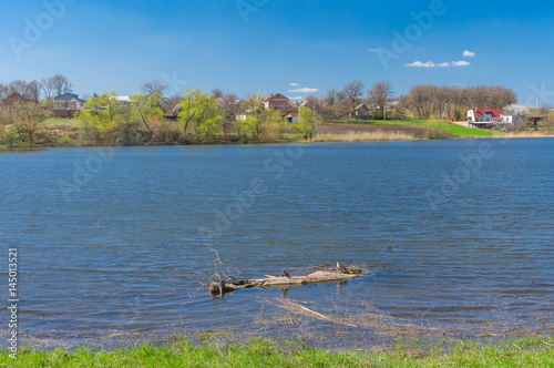 Fotografering Pictorial spring landscape with Suha Sura river in Vasylivka village near Dnepr