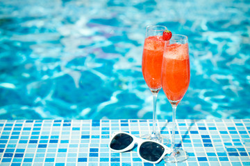 cocktail on the pool nosing at the tropical resort, 