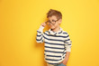 © Africa Studio - Cute stylish boy on color background
