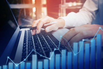 Businessman working with laptop with growing diagram graph.Business technology connectivity.strategy success