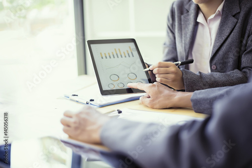 Fotografía Business people analyzing investment charts with teblet in meeting room, Account