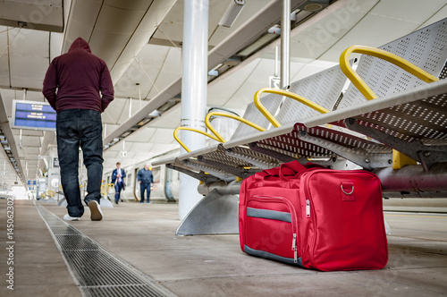 Cuadros en Lienzo Terrorism and public safety concept with an unattended bag left under chair on p