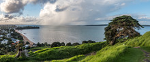 Couple Enjoying The View To North Shore Landscape From North Head Devonport, New Zealand.