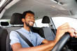 © mimagephotos - Close up happy african american man driving car