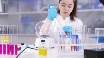 Wall Mural - Schoolgirl in chemical lab