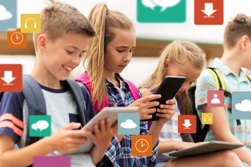 Wall Mural - happy elementary school students with tablet pc