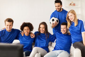 Wall Mural - friends or football fans watching soccer at home