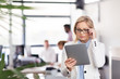 © Syda Productions - businesswoman with tablet pc at office