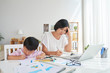 © DragonImages - Working at home with kid