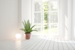 © AntonSh - White empty room with green landscape in window. Scandinavian interior design. 3D illustration