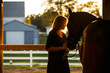 © Shelley Paulson - Woman and horse in barn