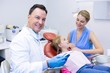 © wavebreak3 - Dentist holding digital tablet in dental clinic