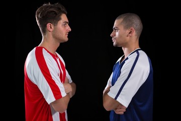 Wall Mural - Two rival football player looking at each other