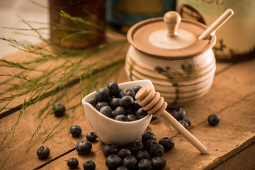 Wall Mural - Blueberry Honey with blueberries and liquid honey in jar