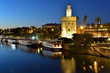 Torre del Oro (Golden Tower) and river cruise boats on the river Guadalquivir in Seville, Andalusia, Spain