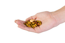 Male Hand Holding A Handful Of Mixed Nuts Isolated On White