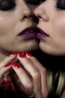 © grufnar - close-up of a sensual female face wearing heavy makeup with reflection in the mirror