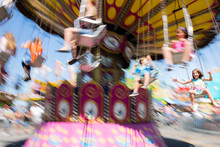 Children On Carousel At Fairground