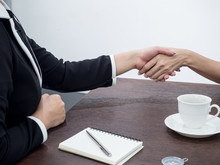 Handshake To Seal A Deal After A Job Recruitment Meeting. Two Business People Shaking Hands. Senior Businessman Shaking Hands  In A Modern Office.Lighting And Color Effect.